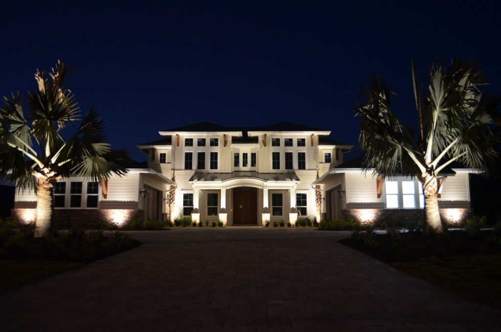 Mansion with bright outdoor lights