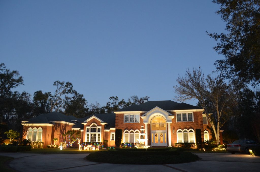 Brick mansion with outdoor lighting