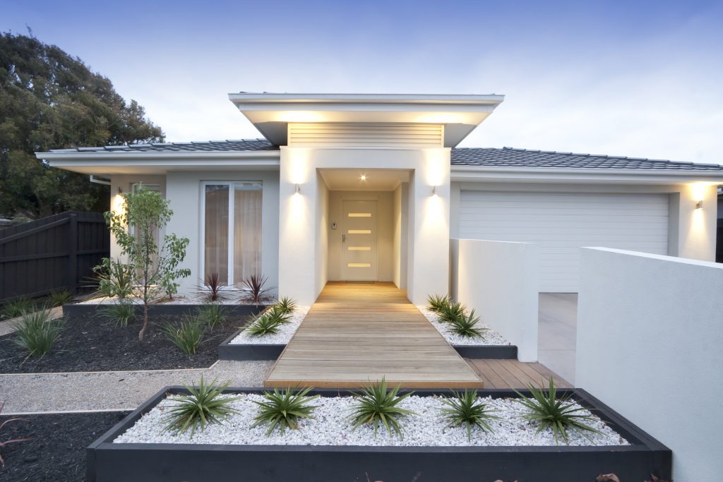 Façade and entryway to a contemporary white home
