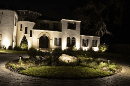 Home outdoor lighting with a circular area in the front lit up as well.